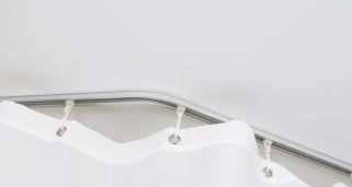 Cómo colocar una barra de cortina de baño curvada: Guía paso a paso